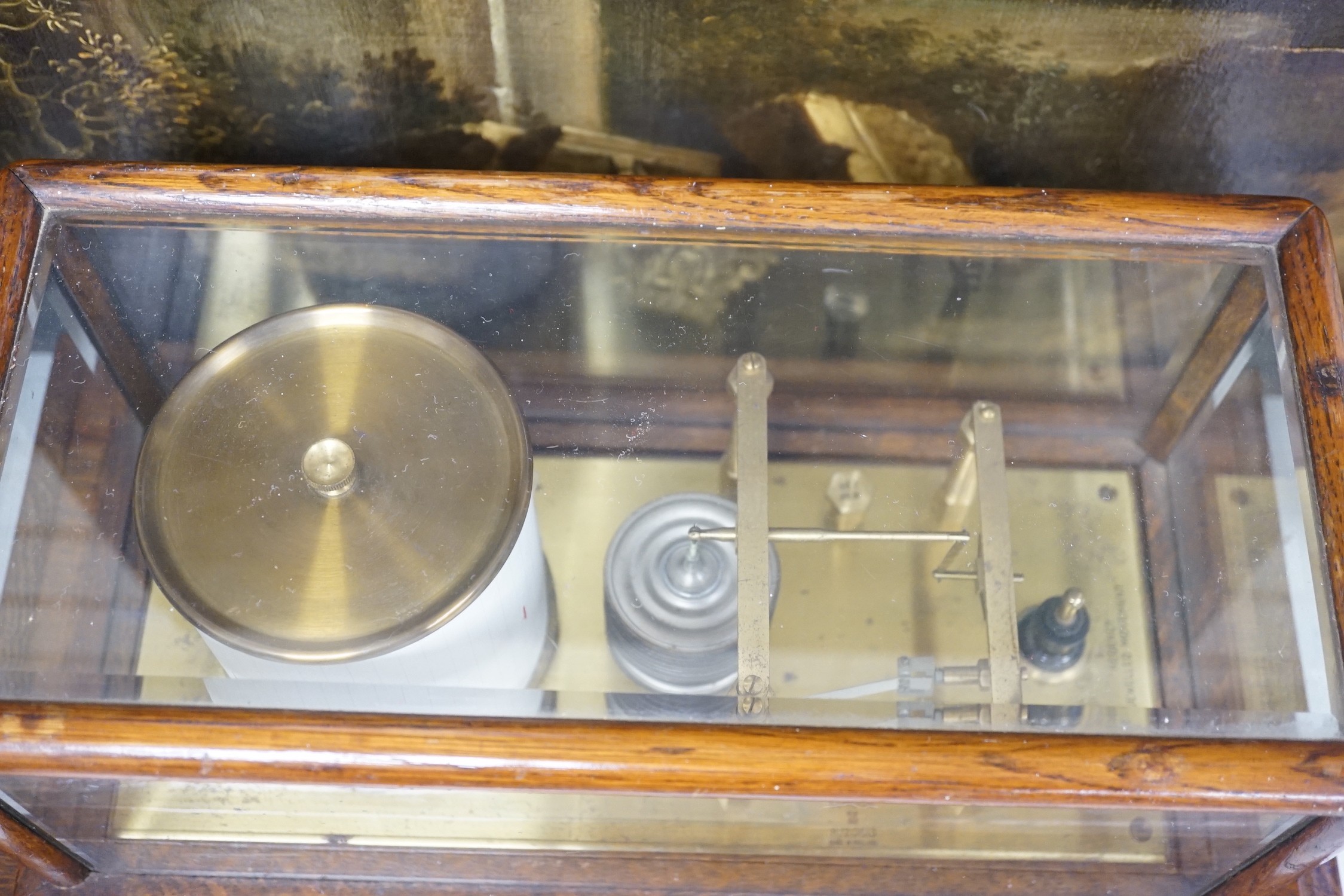 A Negretti and Zambra oak cased barograph number R/20613 with plaque reading ‘To C.C. Prigge as a token of esteem from his C.P.C. and B&P friends July 1949’